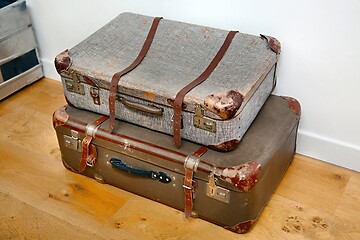 Image showing Vintage suitcases on the floor