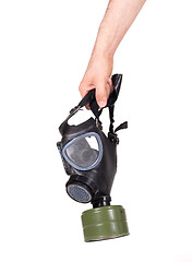 Image showing Man holding vintage gasmask isolated on white - Green filter