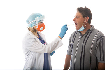 Image showing Healthcare worker swabbing a patient for respiratory viruses COV