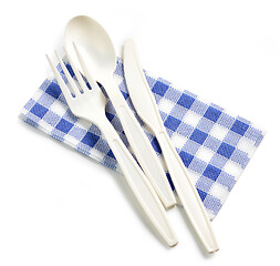 Image showing white take away spoon and fork on paper napkin