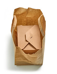 Image showing cardboard box in paper bag