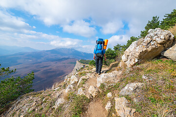 Image showing The tourist in mountain