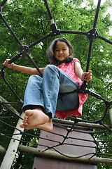 Image showing Portrait of a young cute girl on a playing field