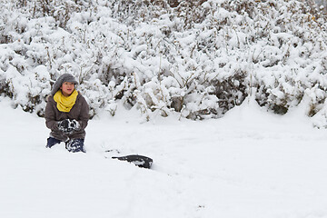 Image showing Girl playing in the snow in winter in denmark