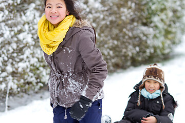 Image showing Girl playing in the snow in winter in denmark