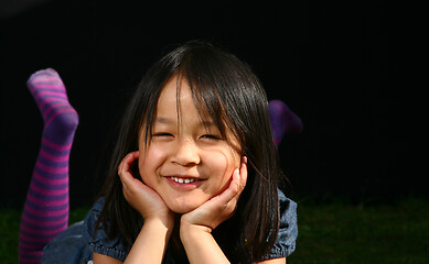 Image showing Portrait of a young cute girl looking at the camera