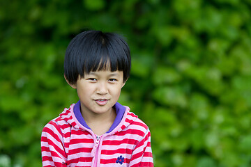 Image showing Portrait of a young cute girl looking at the camera