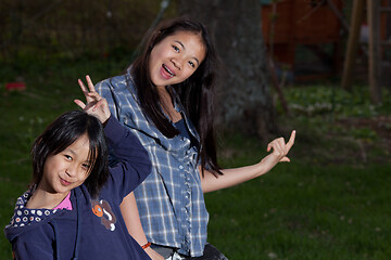 Image showing Portrait of a young sisters looking at the camera