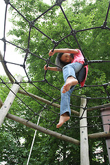 Image showing Portrait of a young cute girl on a playing field