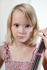 Image showing Portrait of a young teenager girl in studio with a cello