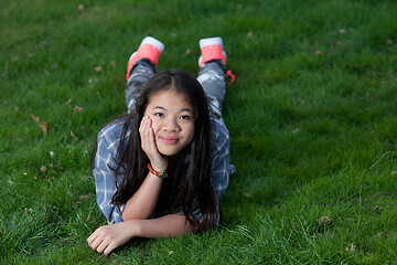 Image showing Portrait of a young cute girl looking at the camera