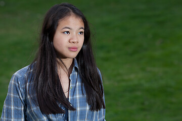 Image showing Portrait of a young cute girl looking at the camera