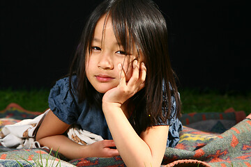 Image showing Portrait of a young cute girl looking at the camera