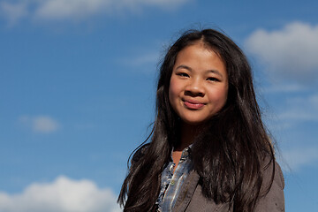 Image showing Portrait of a young cute girl looking at the camera