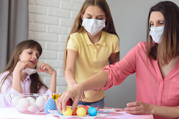 Image showing Ill family paints eggs for Easter