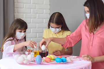 Image showing Mom and two quarantined daughters prepare for Easter