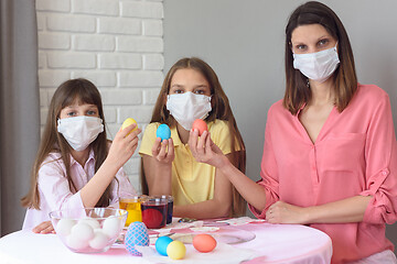 Image showing quarantined family paints eggs for easter