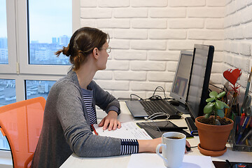 Image showing Female student studying remotely at home online