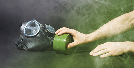 Image showing Man in room filled with smoke, trying to reach for vintage gasma