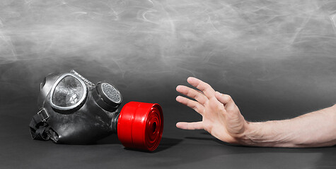 Image showing Man in room filled with smoke, trying to reach for vintage gasma