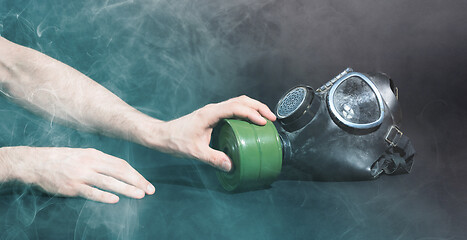 Image showing Man in room filled with smoke, trying to reach for vintage gasma