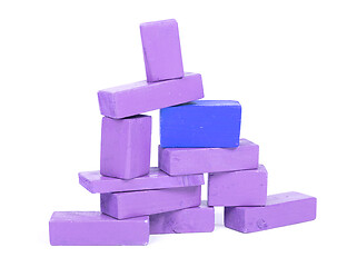 Image showing Vintage purple building blocks isolated on white, one standing o