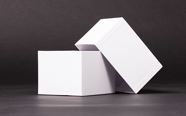 Image showing Opened blank White box on black background