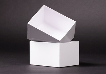 Image showing Opened blank White box on black background