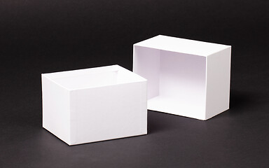 Image showing Opened blank White box on black background