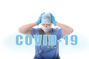 Image showing Hospital nurse overwhelmed and stressed during COVID-19 pandemic