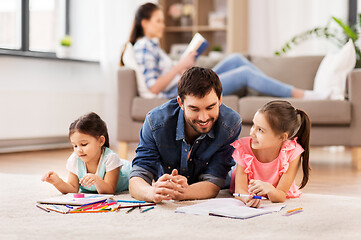 Image showing father with little daughters drawing at home