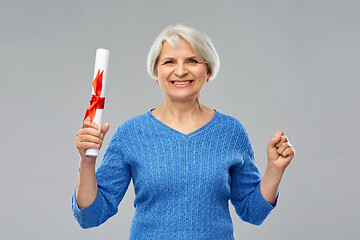 Image showing happy senior graduate student woman with diploma