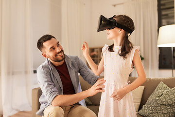 Image showing father and daughter in vr glasses playing at home