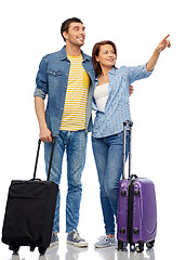 Image showing happy couple of tourists with travel bags