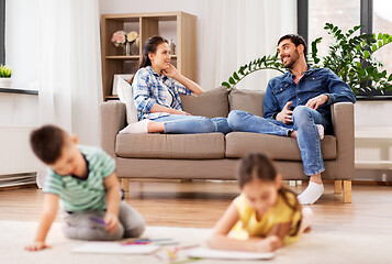 Image showing happy family spending free time at home