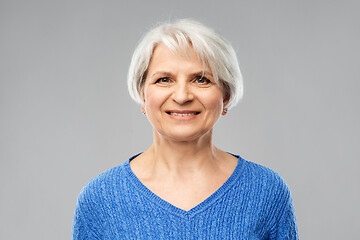 Image showing portrait of smiling senior woman in blue sweater