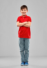 Image showing smiling boy in red polo t-shirt with crossed arms