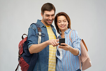 Image showing happy couple of tourists with smartphone