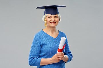 Image showing happy senior graduate student woman with diploma