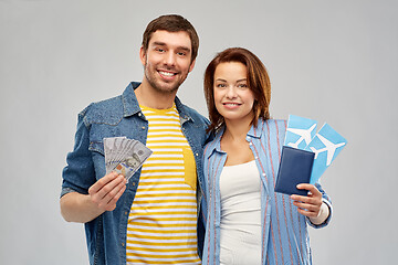 Image showing couple with air tickets, passport and money