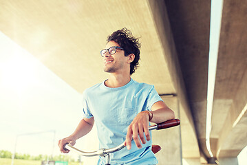 Image showing young hipster man riding fixed gear bike