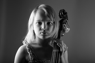 Image showing Portrait of a young teenager girl in studio with a cello