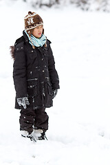 Image showing Girl playing in the snow in winter in denmark