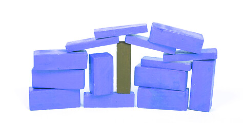 Image showing Vintage blue building blocks isolated on white, one standing out