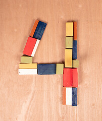 Image showing Old wooden blocks, toghether they make the number 4