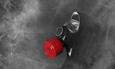 Image showing Man in a gas mask in the smoke