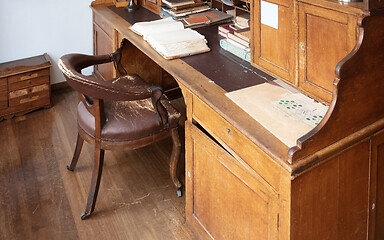 Image showing Very old desk, full of old books and old paper