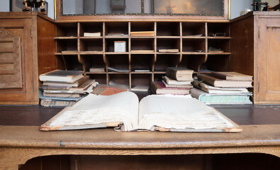 Image showing Very old desk, full of old books and old paper