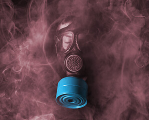 Image showing Man in a gas mask in the smoke