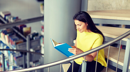 Image showing high school student girl reading book at library